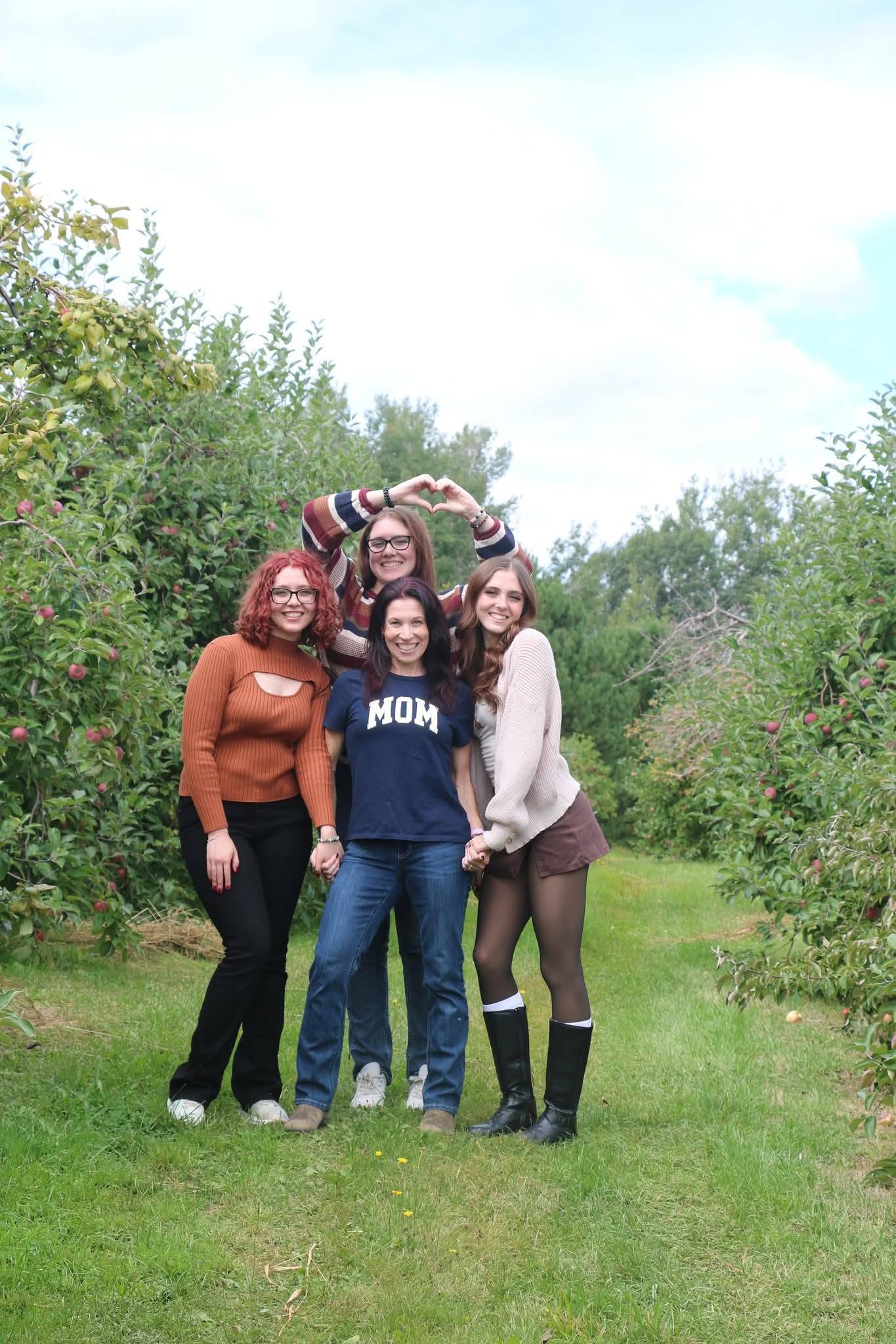 4 girls in apple orchard
